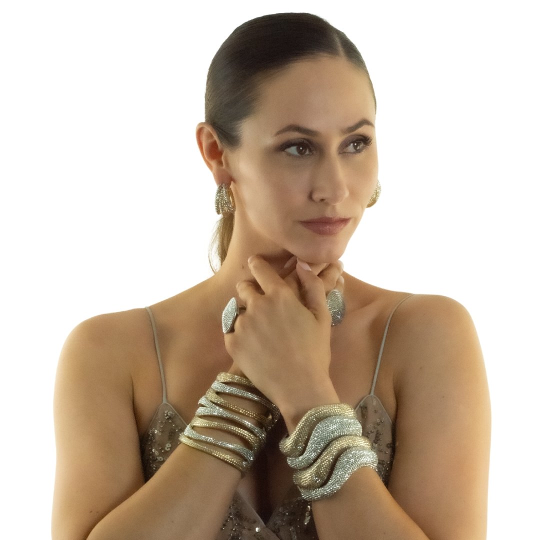 Beautiful model showcasing assorted hand applied crystal bracelets. Link direct user to the ALL BRACELETS & Cuffs menu