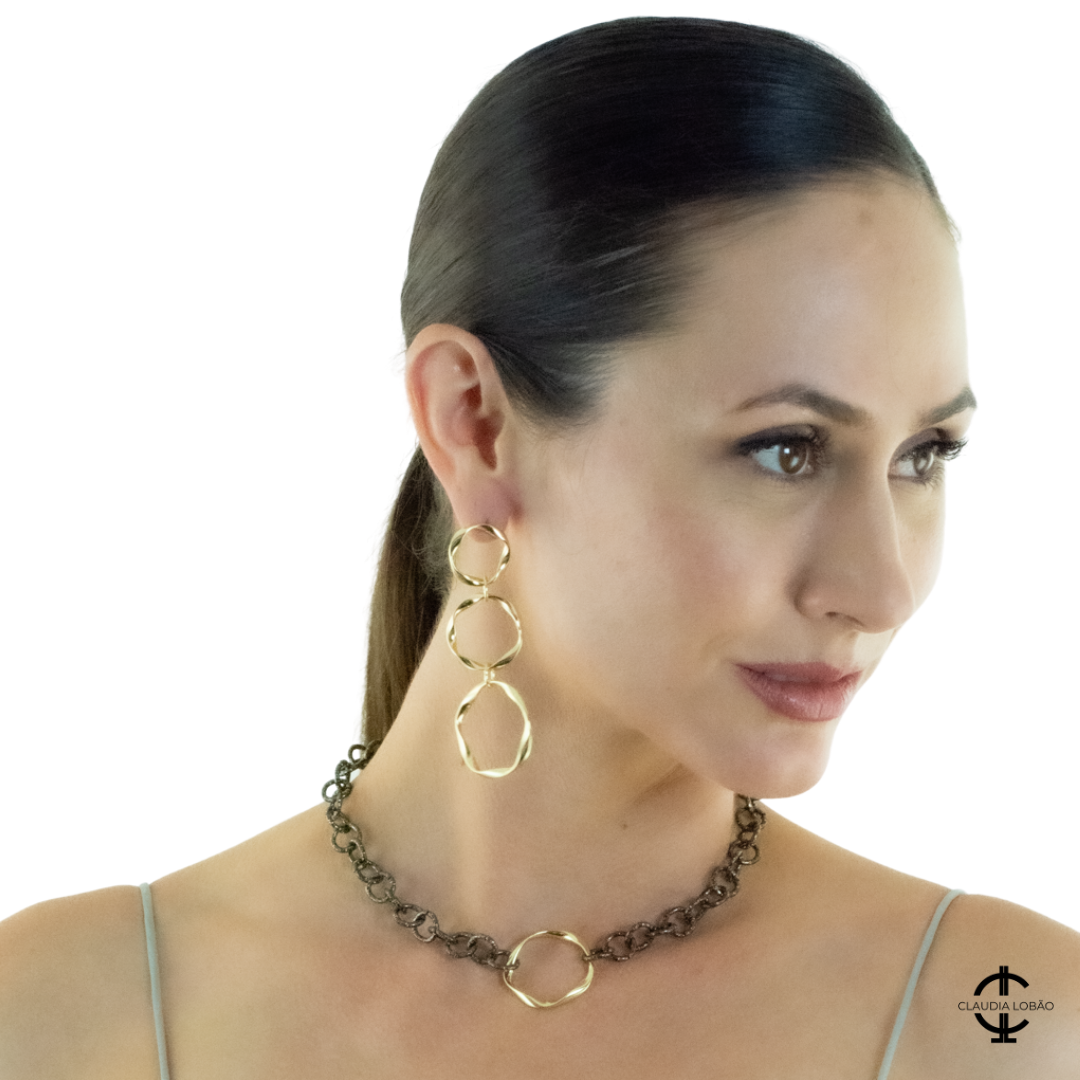 Image of beautiful model wearing drop circle hoop style E-3725-G. Clicking on image links to All Earrings section
